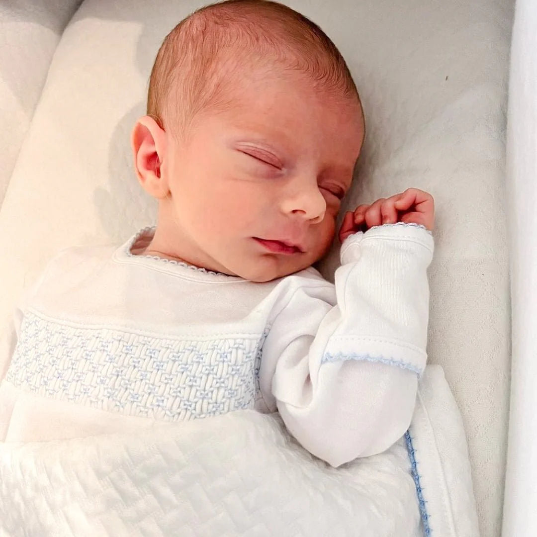 Smocked White Footie with Blue Trim
